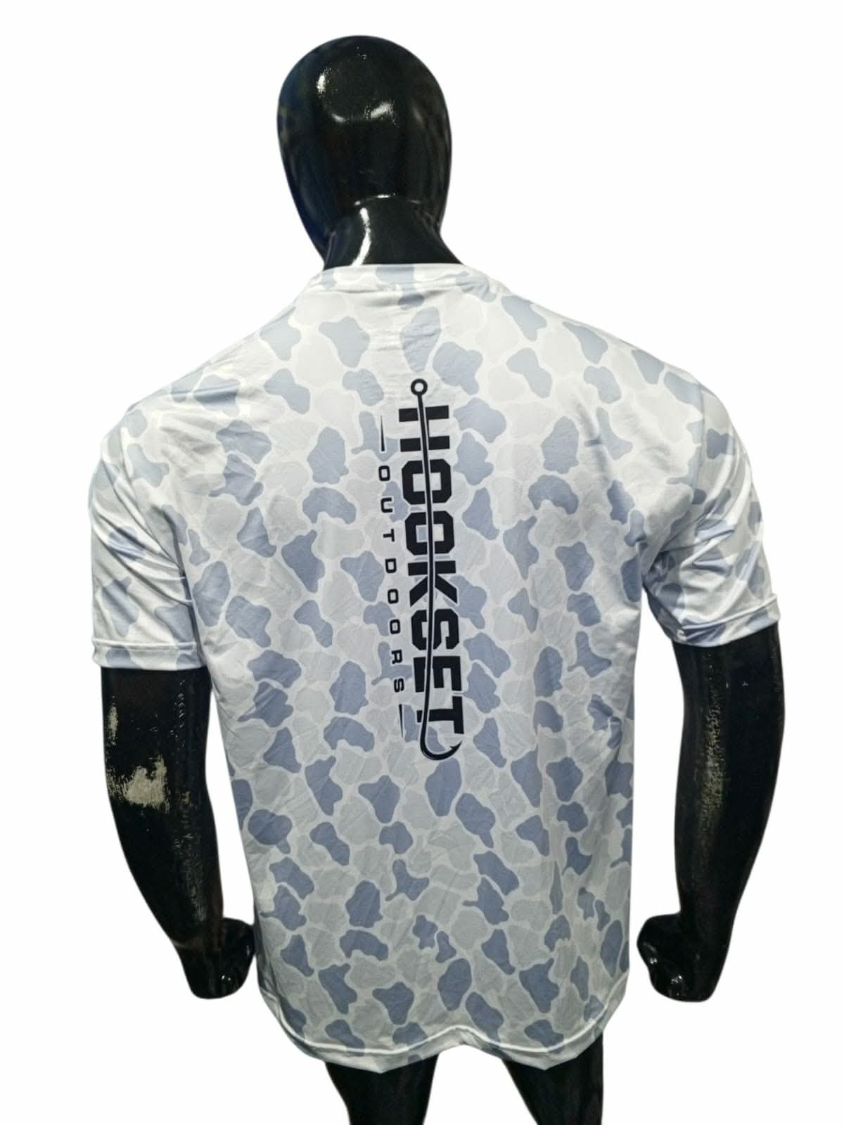 Back view of Hookset Outdoors Blue Ice camouflage short sleeve performance fishing shirt with vertical Hookset logo displayed on mannequin.
