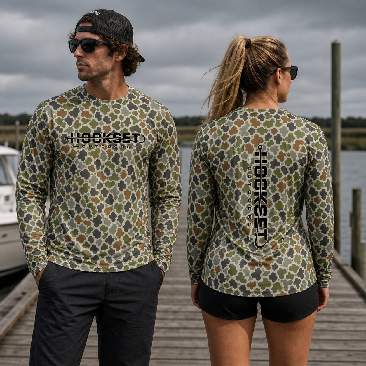 Man and woman wearing HOOKSET Sawgrass UPF 50 camo fishing hoodies on a dock